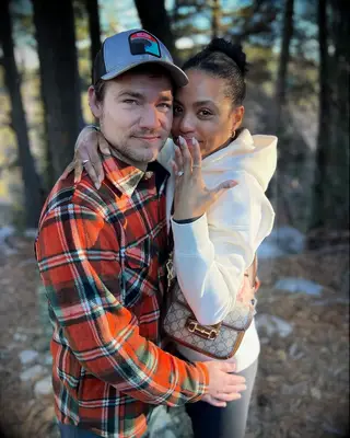 Daniel Durant and Britt Stewart posing after proposal