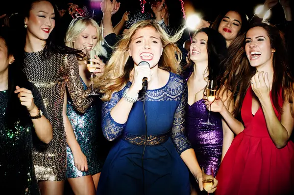 Friends singing the top karaoke songs of all time