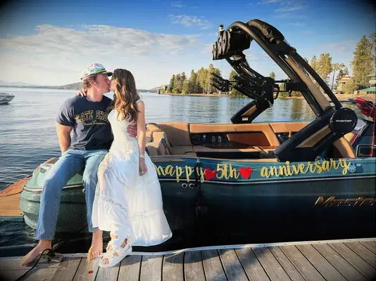 Keleigh Teller proposing to Miles Teller with a boat on their 5th anniversary