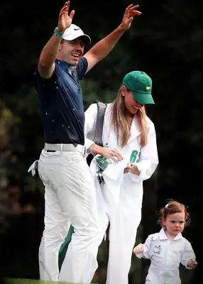 Rory McIlroy, Erica Stoll, and their daughter at the 2023 Masters