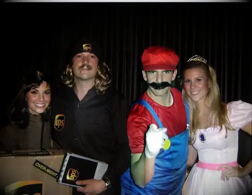 Couple at Giants Halloween party with Tim and Elizabeth Hasselbeck