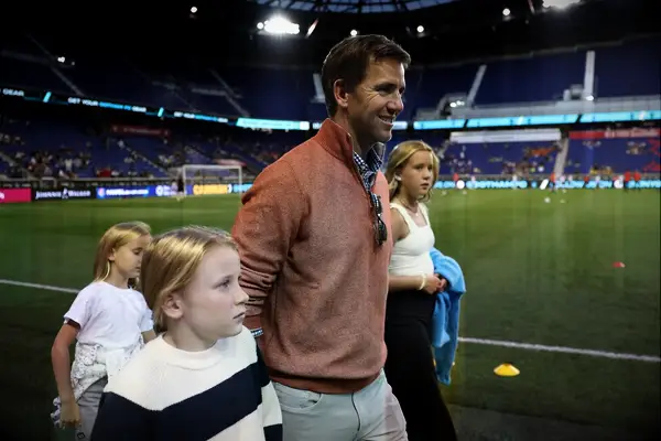 Eli walking with his three kids