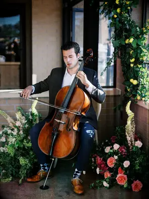 Rehearsal dinner musician with floral decor