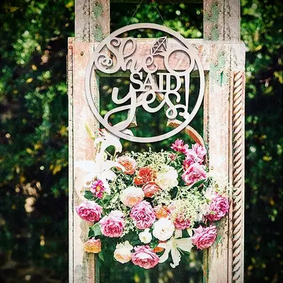 Wooden sign for a bachelorette that reads She Said Yes