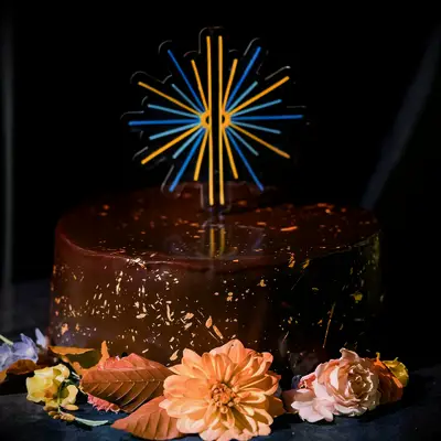 Chocolate engagement cake with gold flecks and blue and yellow cake topper