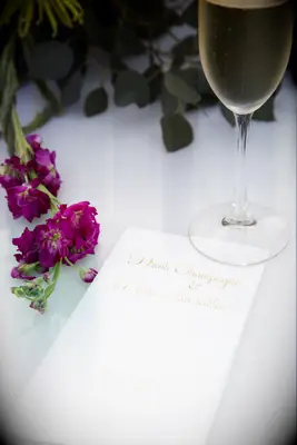 Bridal shower menu with a glass of champagne