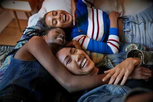 Women relaxing during at-home bachelorette party