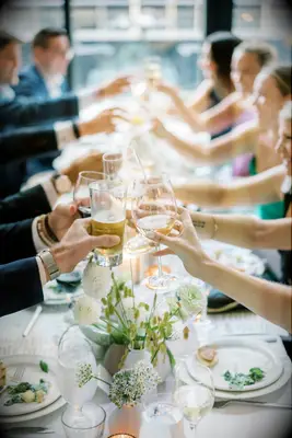 Guests raise a glass to say cheers to the expectant couple