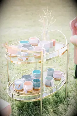 Bar cart with pastel-hued coffee mugs