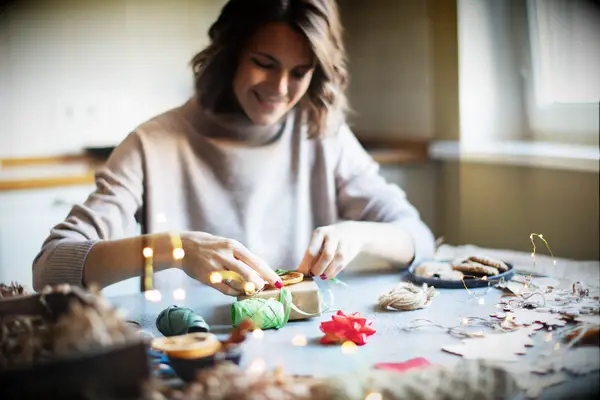 Woman creating winter crafts for winter bridal shower