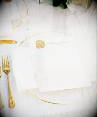 Gilded place settings at Bridgerton themed bridal shower