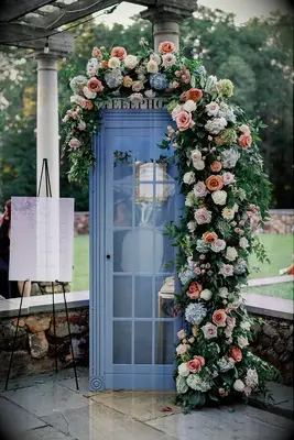 Flower photo backdrop at Bridgerton inspired bridal shower