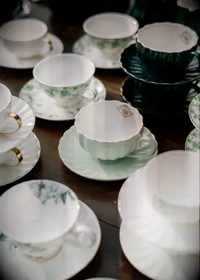 Pastel green teacups at Bridgerton inspired bridal shower