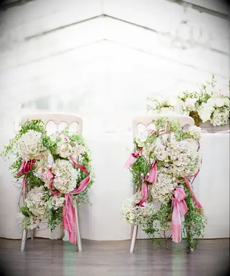 Floral covered chairs at Bridgerton inspired bridal shower