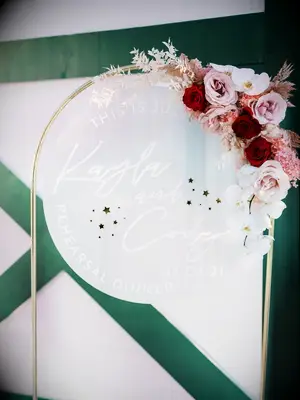 Modern acrylic sign at rehearsal dinner