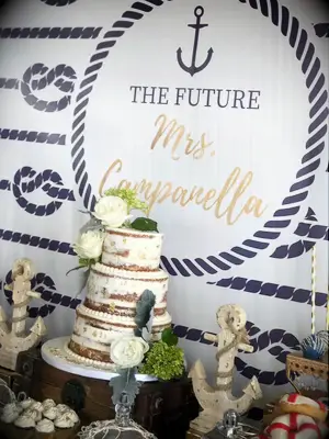 Personalized backdrop with name in gold, anchor graphic and sea knots