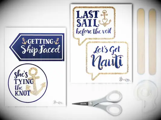 Glittery gold and navy props with puns like, She