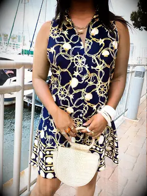 Navy collared sleeveless dress with gold and white nautical details