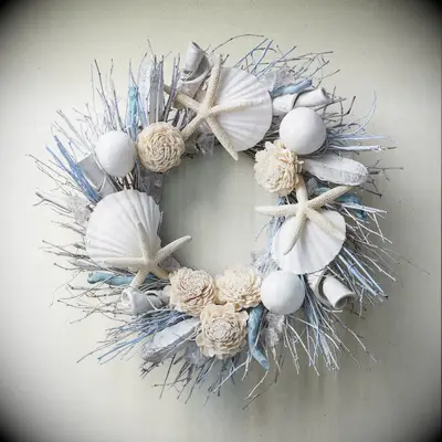 Blue and white seashall and starfish wreath for beach-themed bridal shower