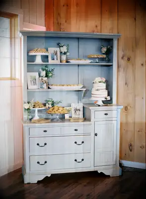Dessert spread in a bureau for a bridal shower. 