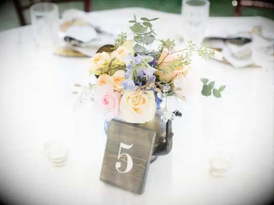 A floral teapot centerpiece.