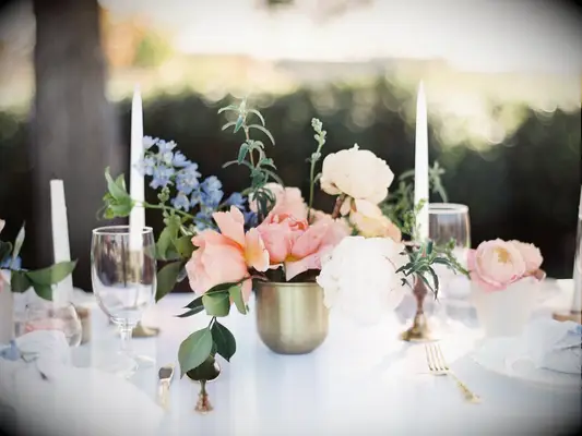 Brass glass floral wedding arrangements.