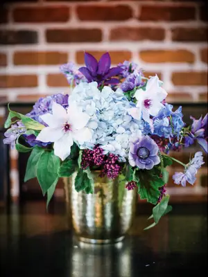 A beautiful blue and lavender floral arrangement.