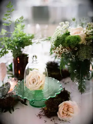 A delicate cloche floral centerpiece.