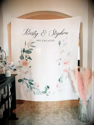 Personalized floral engagement party backdrop