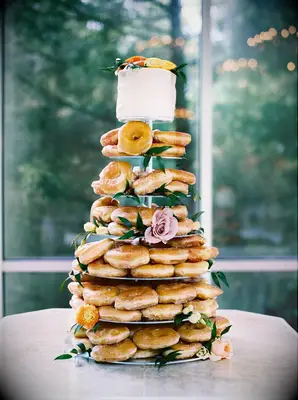 bridal shower brunch food idea donut tower with mini cake at the top