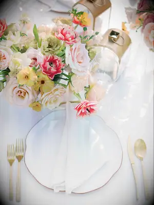 bridal shower brunch decoration idea stylish place setting with pink and yellow flower centerpiece