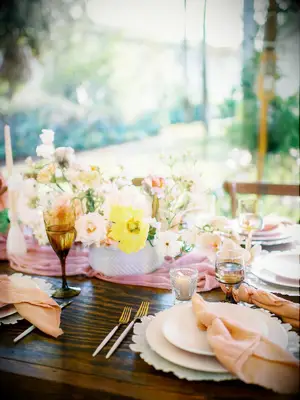 bridal shower brunch decoration idea pink and yellow centerpiece with matching glassware and napkins