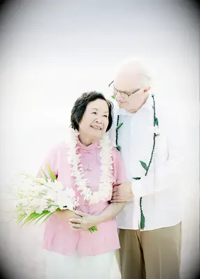 Elderly couple at vow renewal on the beach