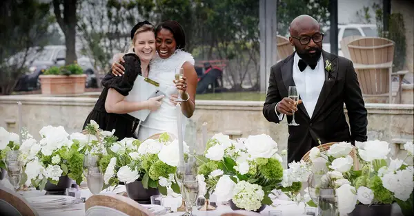 how to plan a wedding as a wedding planner; bride hugging planner