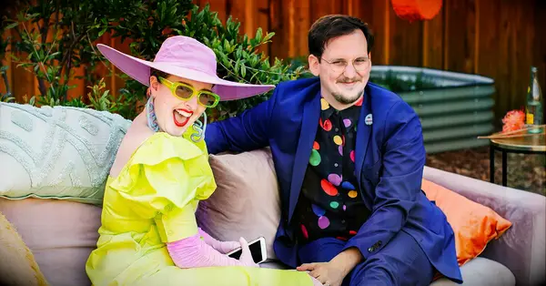 wedding guests laughing; seek wedding planning advice from family