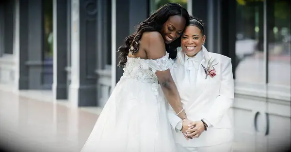 wedding planning questions for couple; couple hugging during wedding