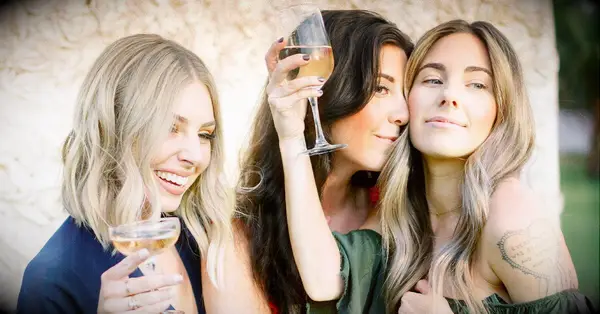 bridesmaids toasting after planning pre-wedding bridal shower