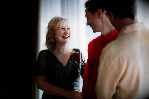 Mom smiling at groom