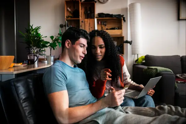 Couple talking on a sofa