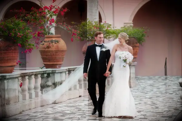 Bride and groom holding hands on wedding day