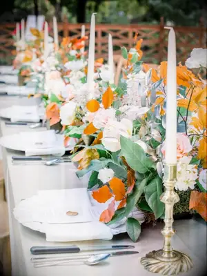 tablescape with green-and-orange centerpieces