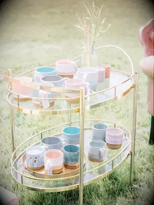 custom mug wedding favors on gold bar cart