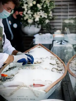 caterer shucking oyster