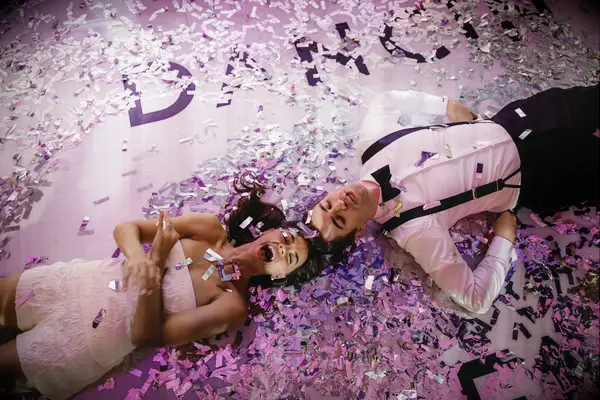 Couple having fun at wedding reception