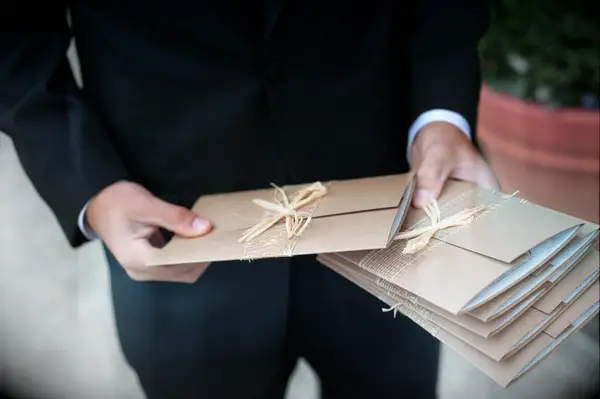 Usher handing out programs