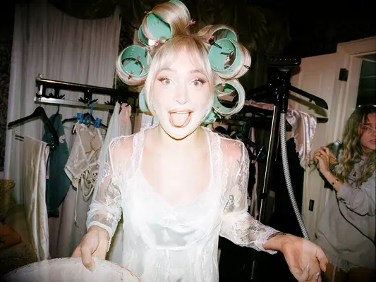 Bride wearing curlers while getting ready, the knot magazine summer 2025 issue