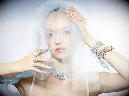 Woman wearing veil and accessories, the knot magazine summer 2025 issue