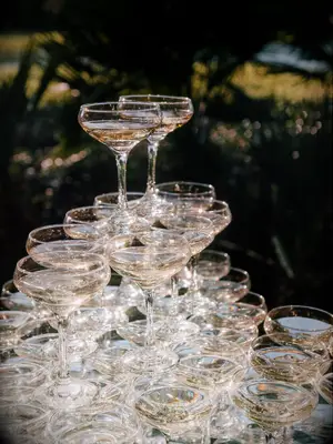 Colorful champagne tower at an outdoor reception. 