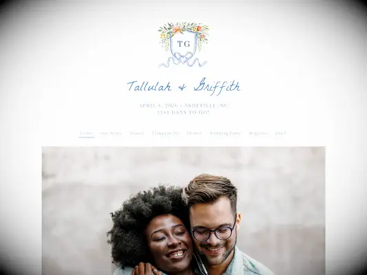 the knot free wedding website example featuring watercolor monogram crest decorated with flowers and light blue ribbon bow