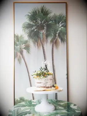 Semi-naked retro beach-themed wedding cake with oranges